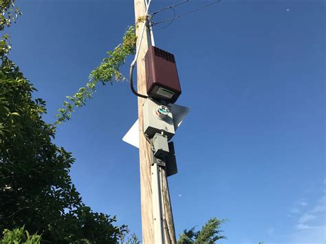 big round metal box on powerline|mysterious boxes on utilities.